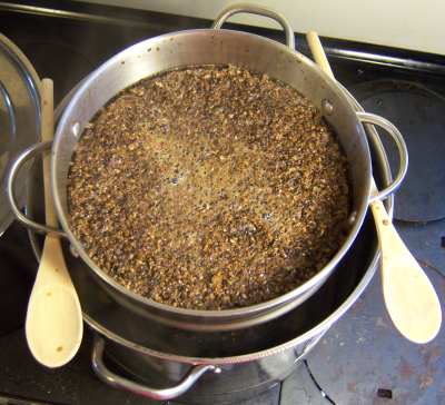 straining the grains with a colander
