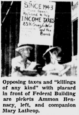 Opposing taxes and “killings of any kind” with placard in front of Federal Building are pickets Ammon Hennacy, left, and companion Mary Lathrop.
