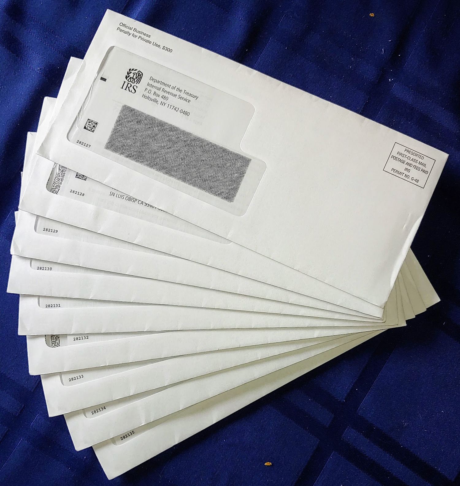 nine envelopes from the I.R.S. stacked